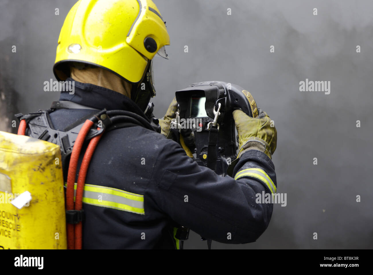 Thermal Image camera being used by firefighter at the scene of a fire