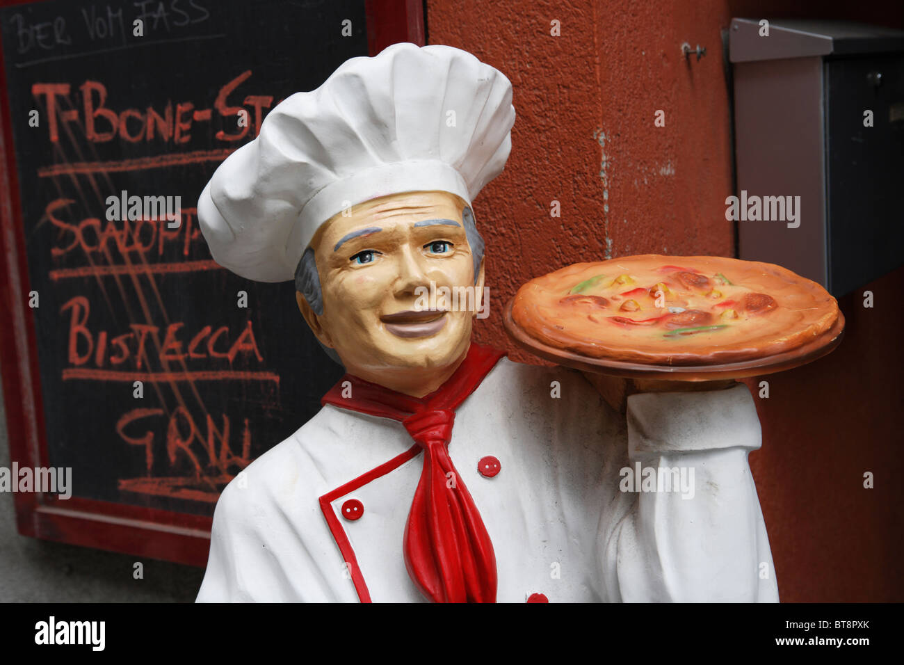 A pizza man mannequin advertising outside a restaurant in Vienna, Austria. Stock Photo