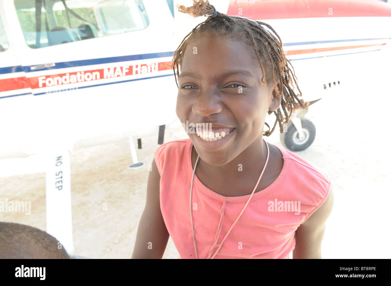 Happy smiling young happy haitian hi-res stock photography and images ...