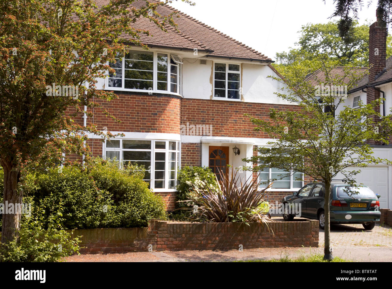 typical thirties semi detached house in art deco style in Thames Ditton
