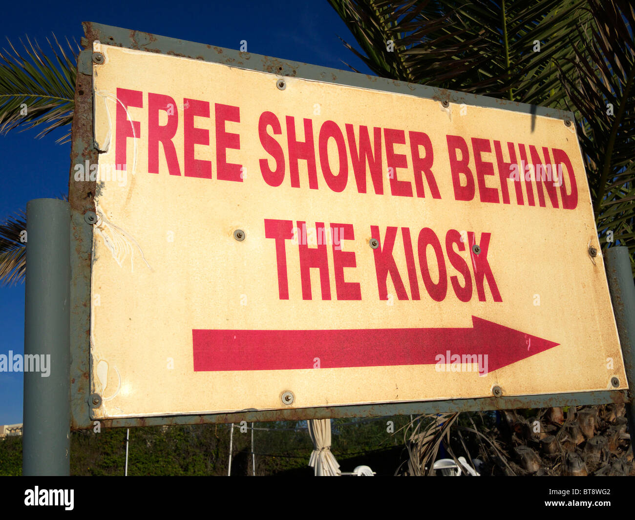 Free shower behind the kiosk sign on the beach Ayia Napa Cyprus Stock