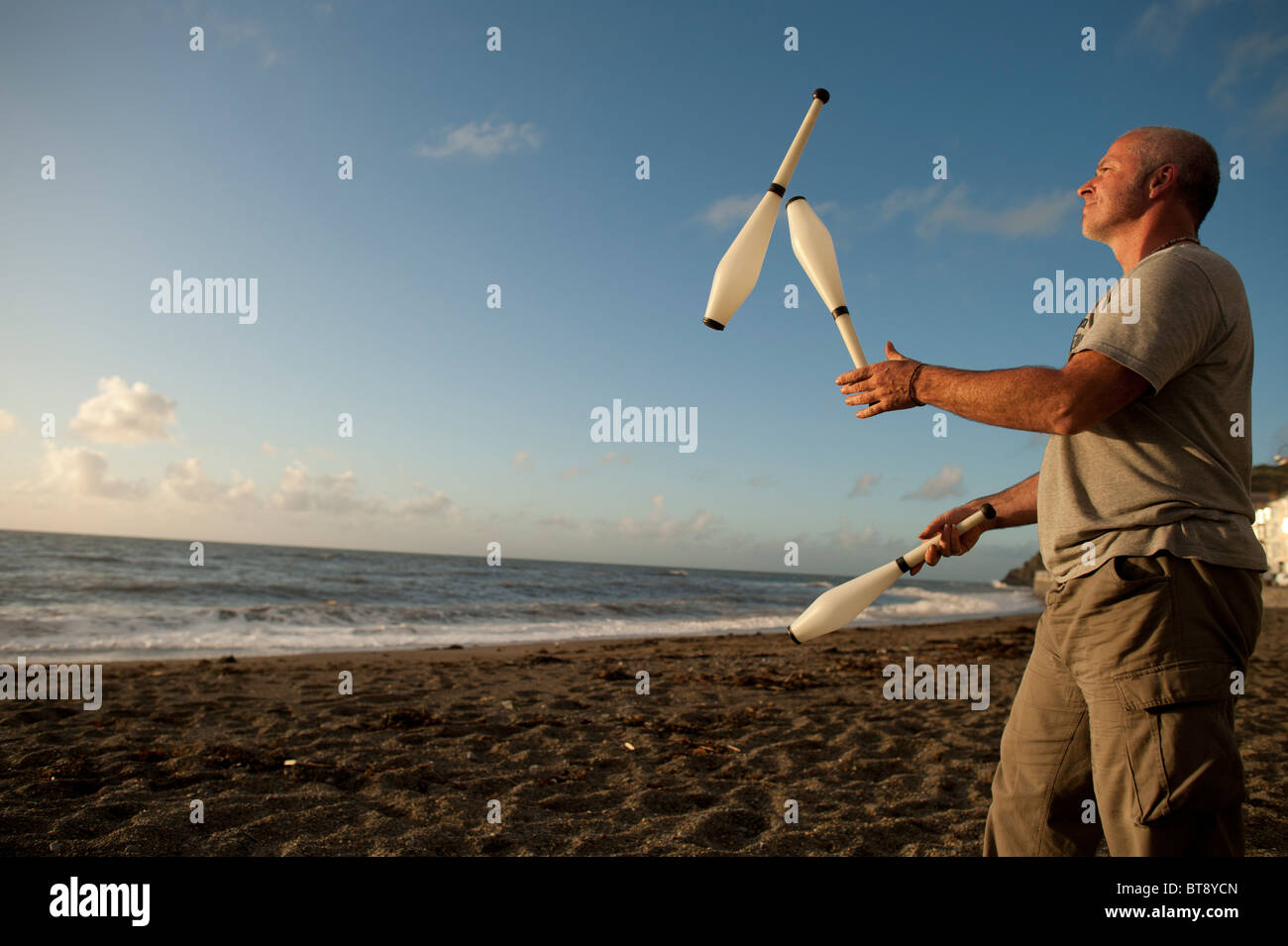 A Aberystwyth University student juggling with three clubs Aberystwyth