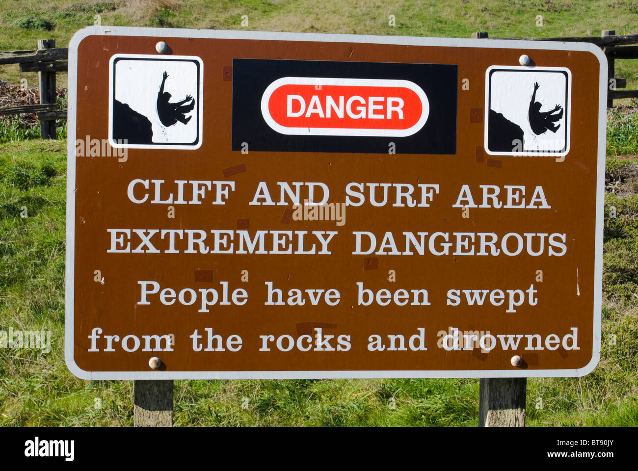 Warning sign on top of dangerous cliff. Marin Headlands, Golden Gate National Recreation Area, California Stock Photo