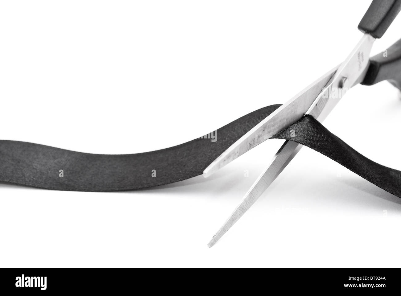 Scissors cutting black ribbon Stock Photo - Alamy