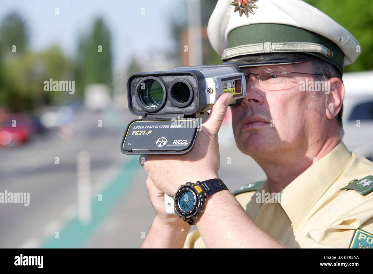 A police officer doing speed monitoring with a laser gun, Koblenz, Rhineland-Palatinate, Germany, Europe Stock Photo