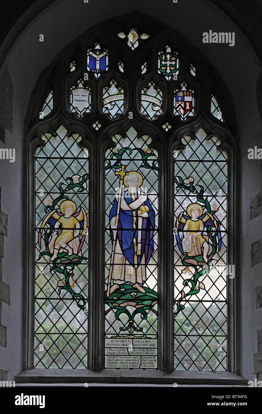 A stained glass window by Christopher b (18861966) depicting Saint Dunstan, All Saint's