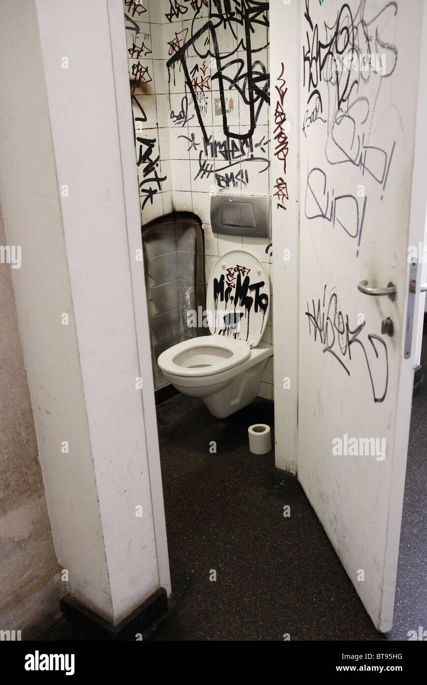 Vandalized Public Toilet with Graffiti Stock Photo