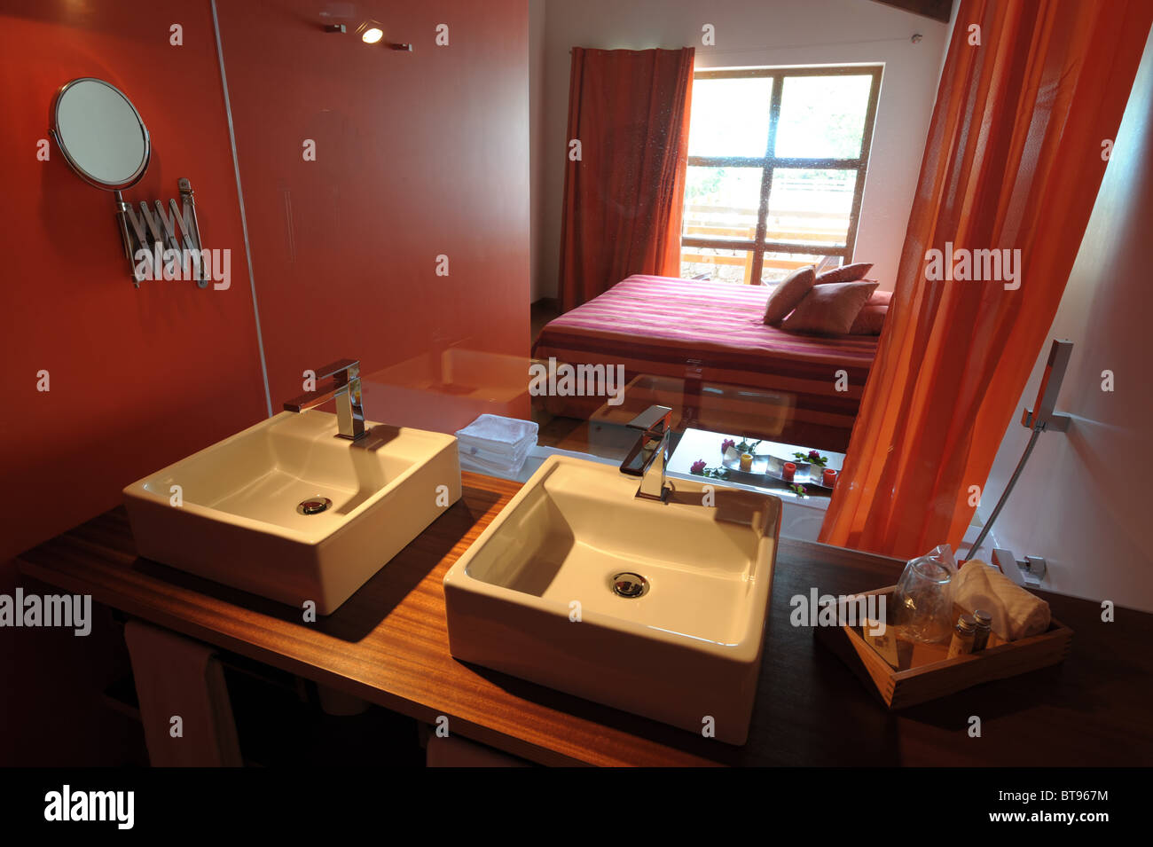 Bedroom And Bathroom Separated By Glass Wall Stock Photo