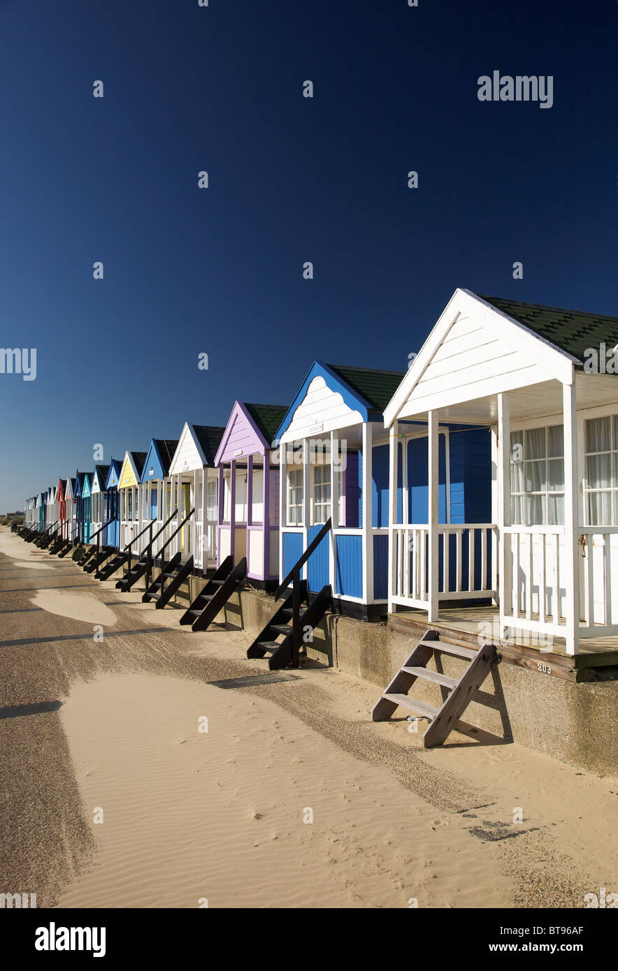 A line of colourful beach huts at Southwold in Suffolk Stock Photo