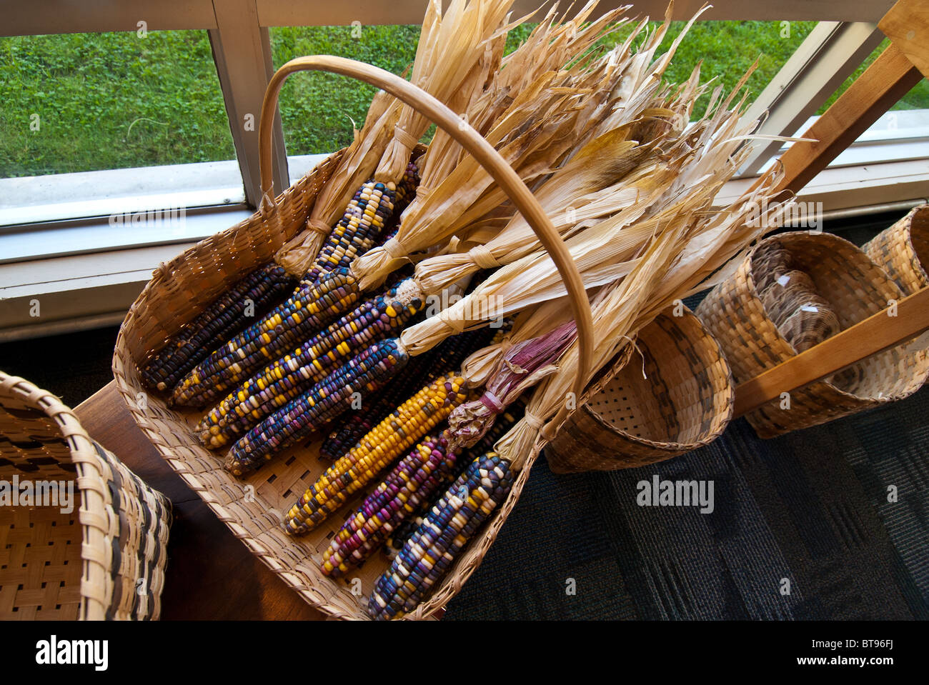 Handicraft cane baskets and variegated maize corn (Indian corn), Cherokee, North Carolina, USA Stock Photo
