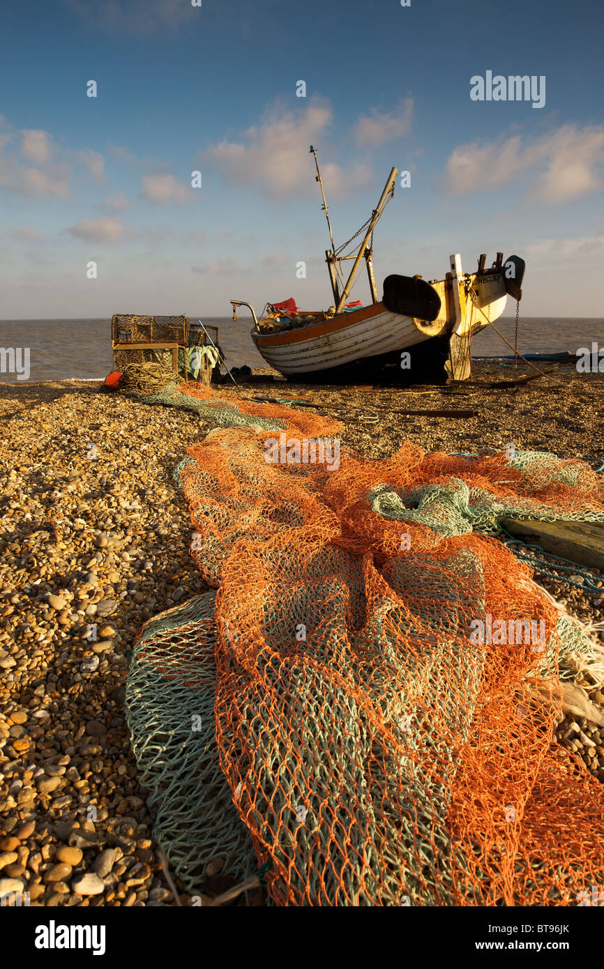 Fishing boat and nets on the beach at Aldeburgh, Suffolk Stock Photo