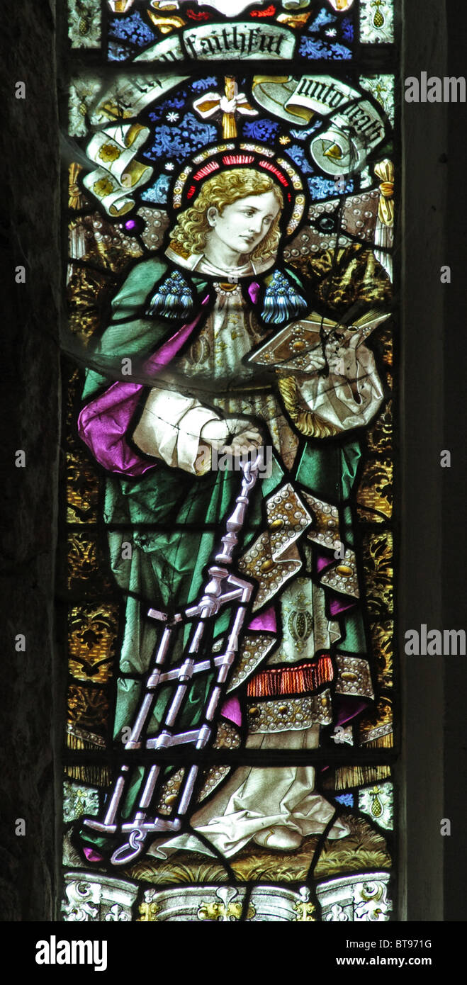 A stained glass window depicting Saint Lawrence with the grid iron