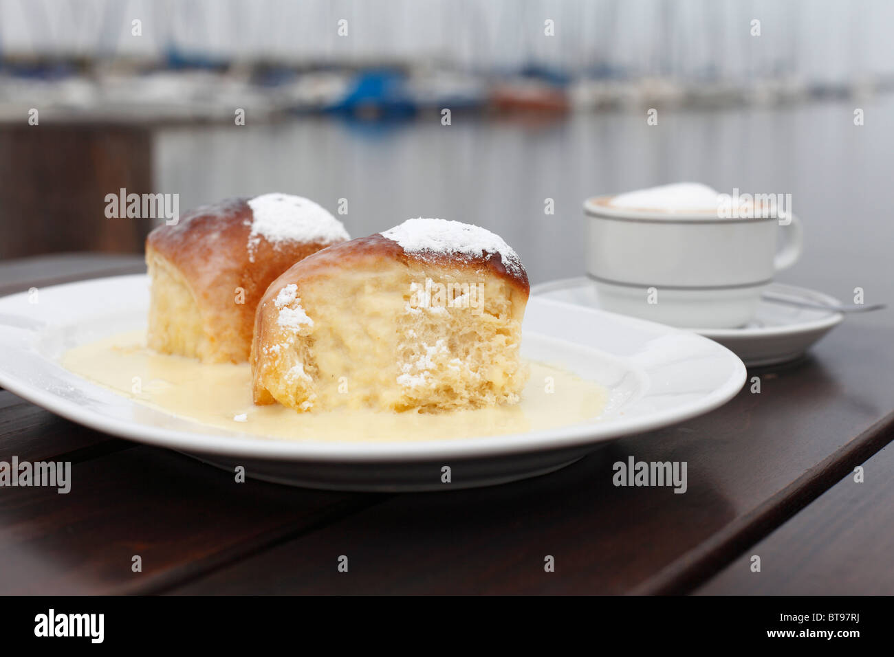 Damson plum buns with vanilla sauce, Rust, Lake Neusiedl, Burgenland, Austria, Europe Stock Photo