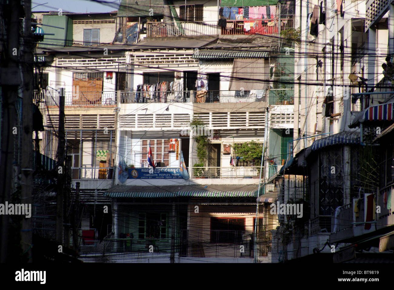 Apartments are packed close together above a city street in densely