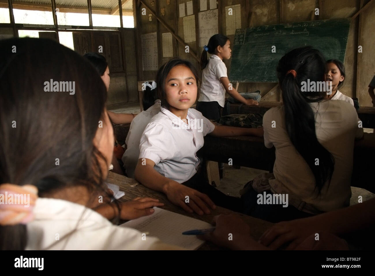 Young elementary school aged boy and girl students are taking a break