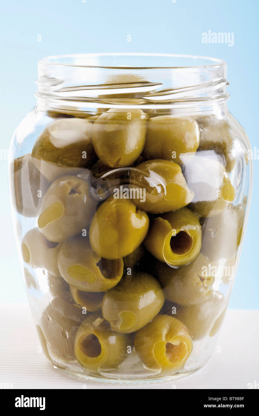 Pitted green olives in a jar Stock Photo Alamy