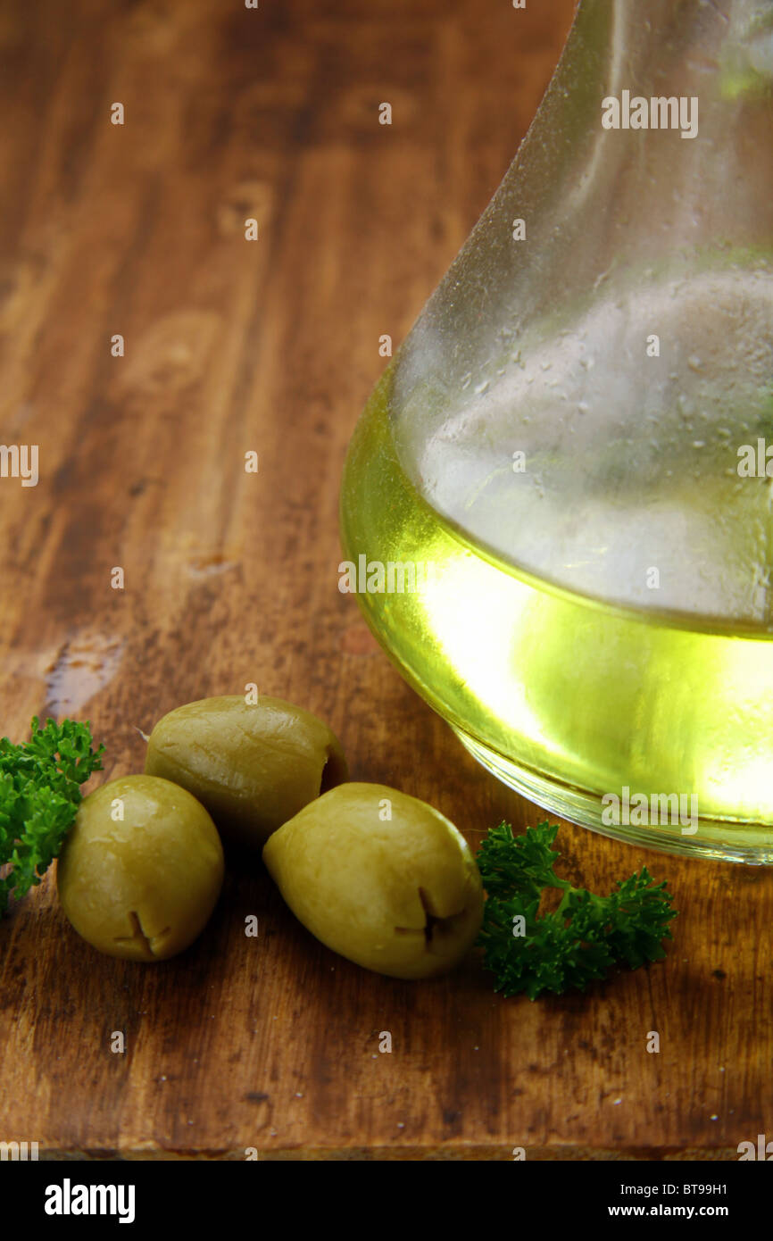 Olive oil and green olives Stock Photo - Alamy