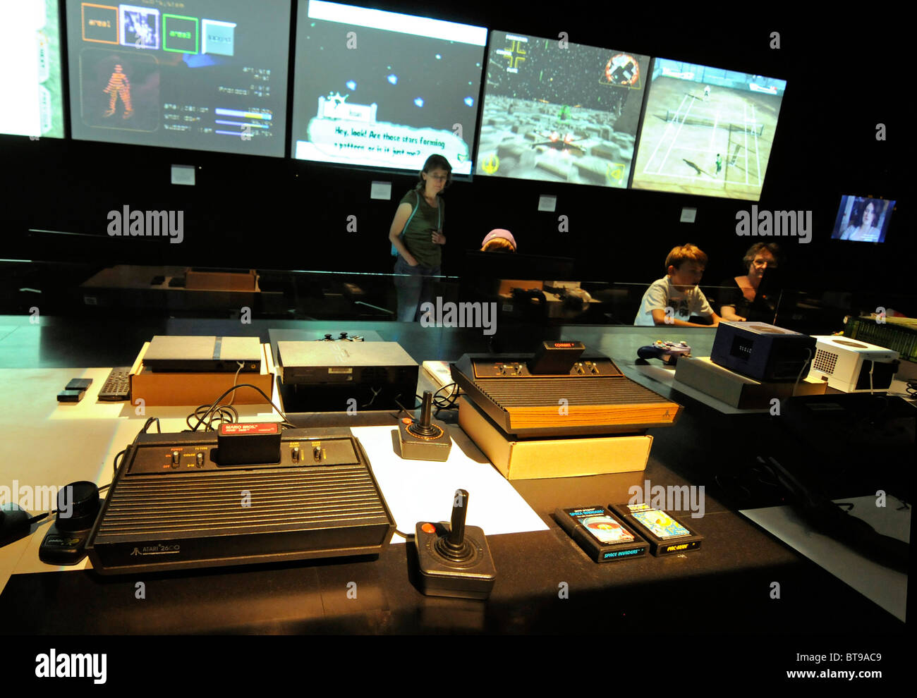 Photo taken during an exhibition about  the history of video games, featuring several consoles and games from the last 40 years. Stock Photo