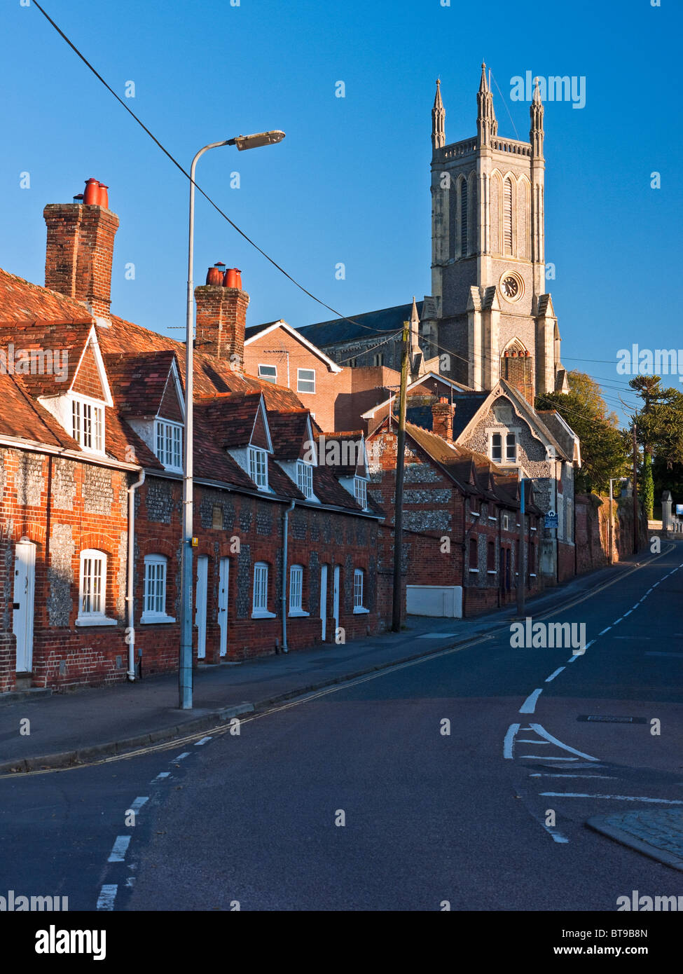 Row of pretty cottages and the Church of St Mary in Andover Hampshire Stock Photo