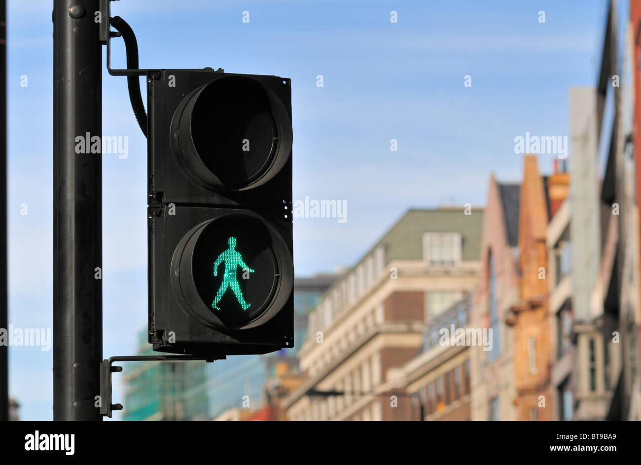 Green pedestrian traffic light, London, United Kingdom Stock Photo