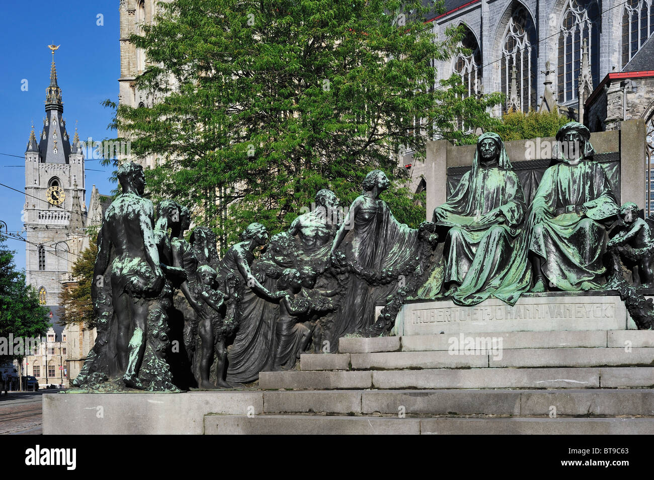 Monument in honour of the Van Eyck brothers and the belfry in Ghent, Belgium Stock Photo