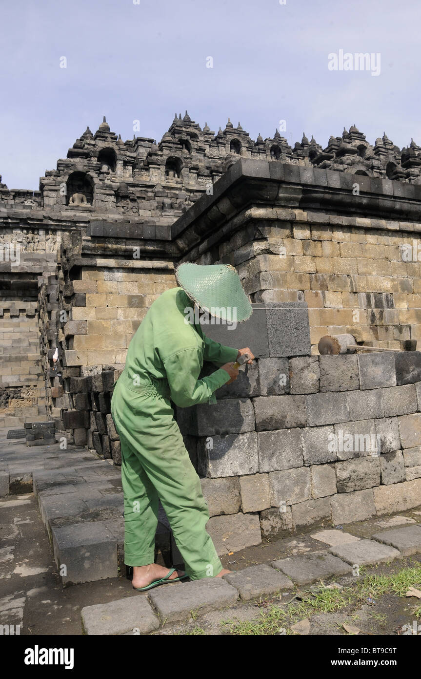 Man Doing Stonemasonry Restoration Of The Borobudur Temple Yogyakarta man-doing-stonemasonry-restoration-of-the-borobudur-temple-yogyakarta