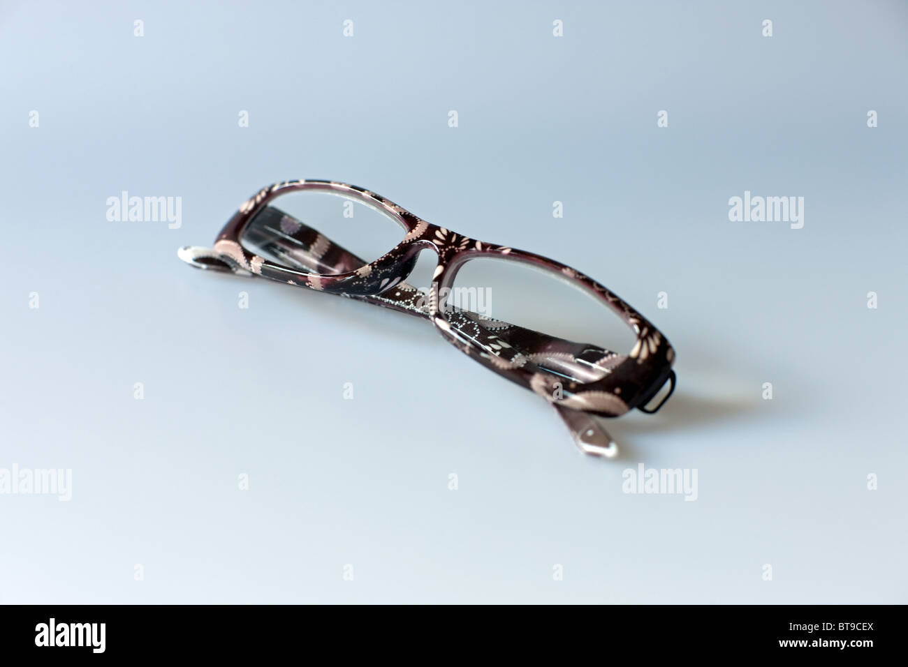 folded reading glasses Stock Photo - Alamy