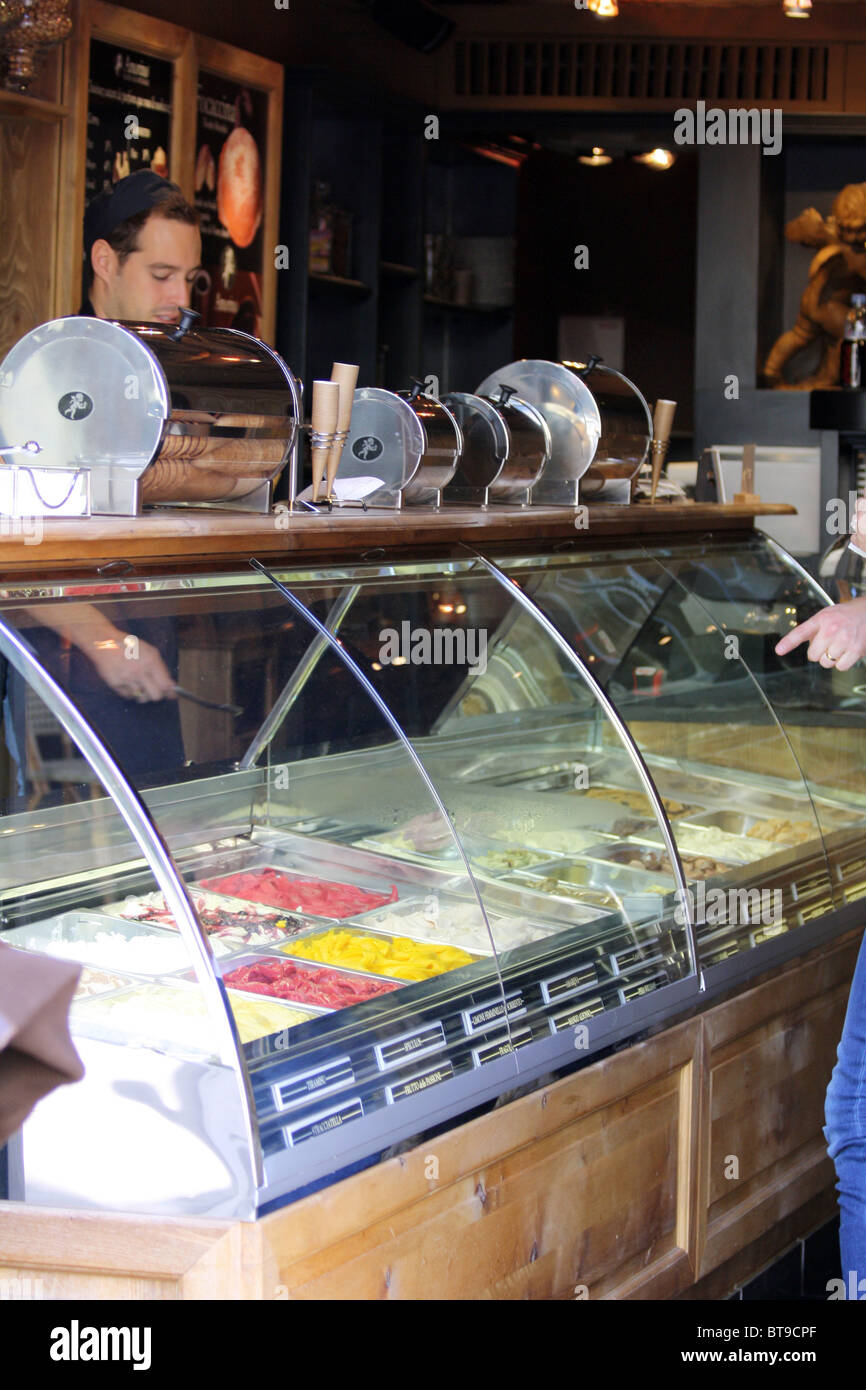 Man serving ice cream in a shop in Paris, France Stock Photo Alamy