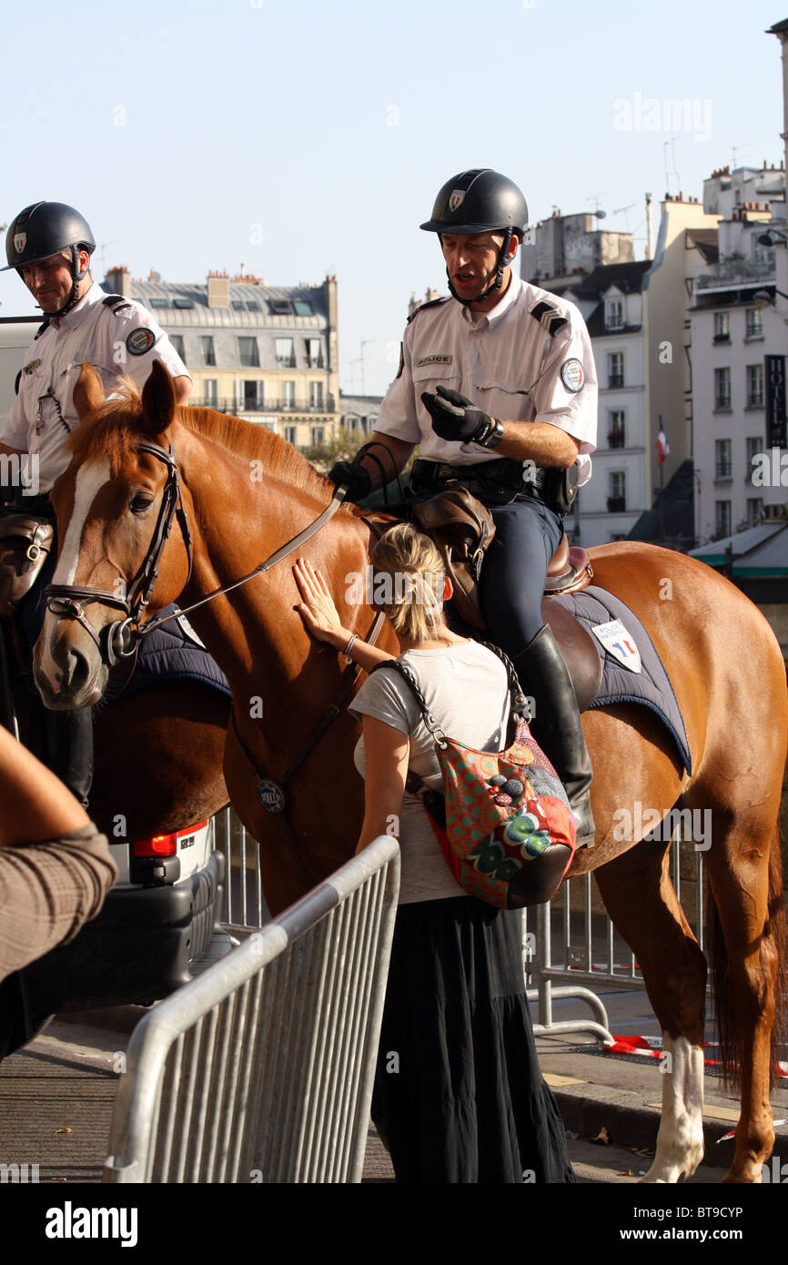 Two french policemen on horseback at a recruitment exhibition in Paris France Stock Photo