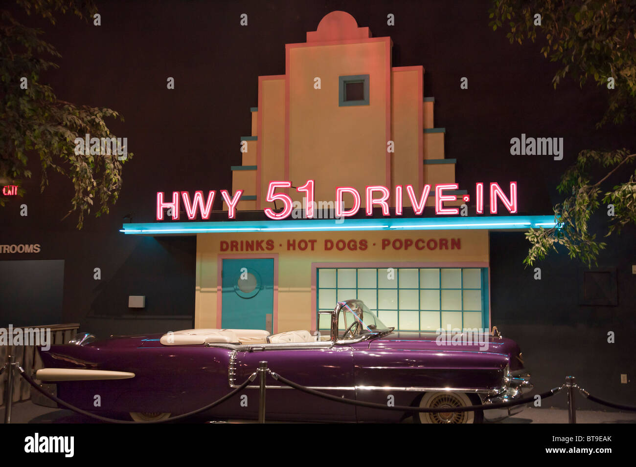 Elvis' purple Cadillac 1956 Eldorado outside fake frontage of Highway