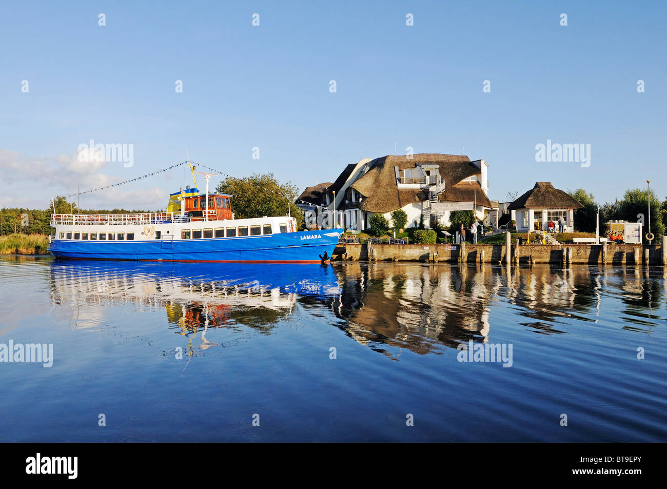 Hotel and tour boat in the harbor of the seaside resort of Baabe, Ruegen Island, Mecklenburg-Western Pomerania, Germany, Europe Stock Photo