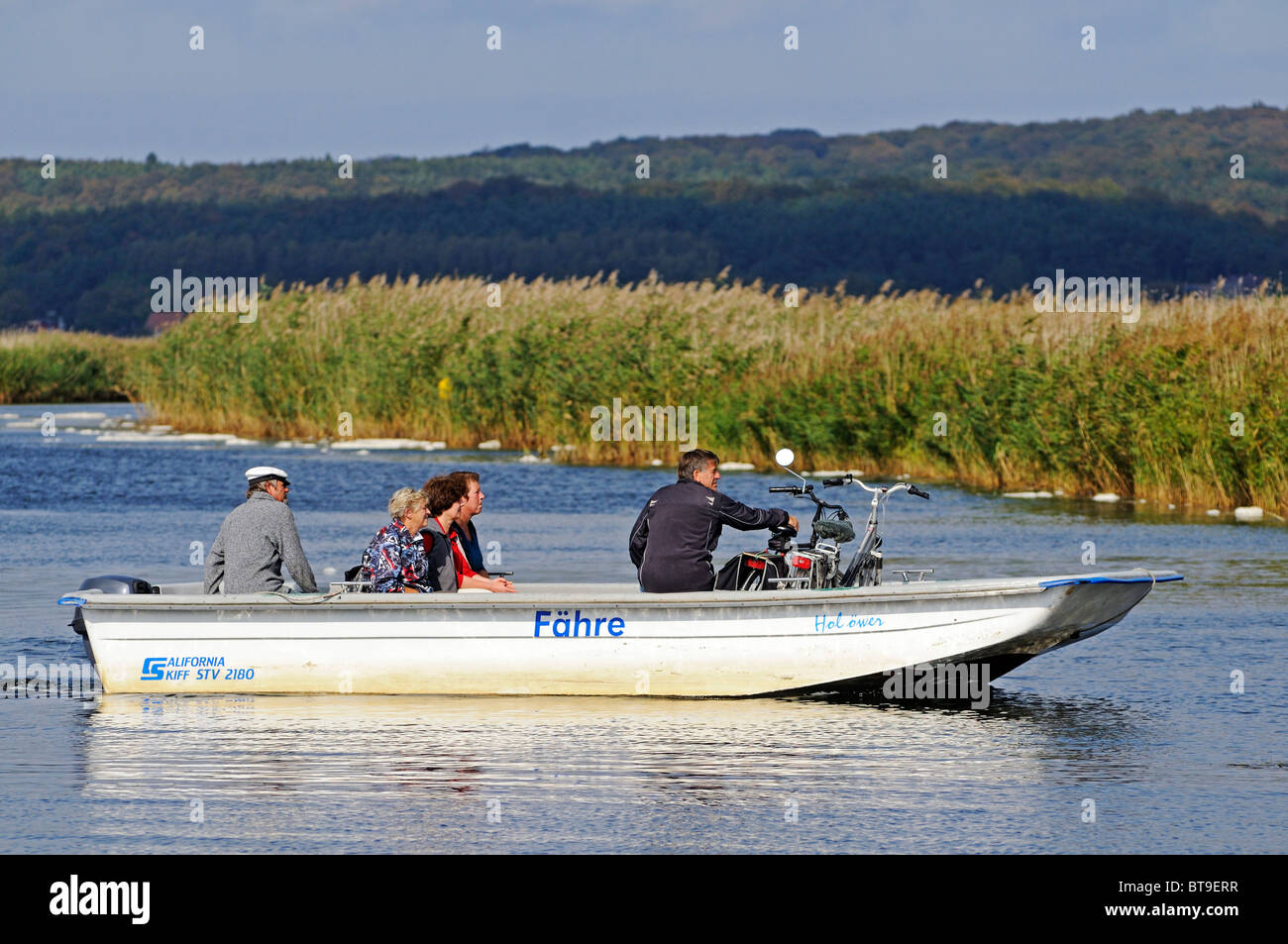 Foot ferry with people and bicycles between Moritzdorf and the seaside resort of Baabe, Ruegen Island Stock Photo