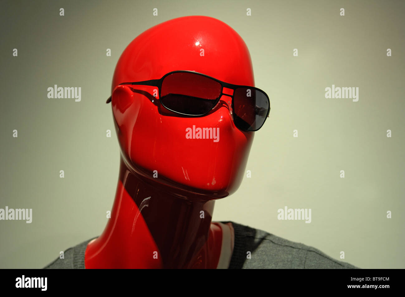 Red-lacquered head of a mannequin wearing sunglasses, Munich, Bavaria, Germany, Europe Stock Photo