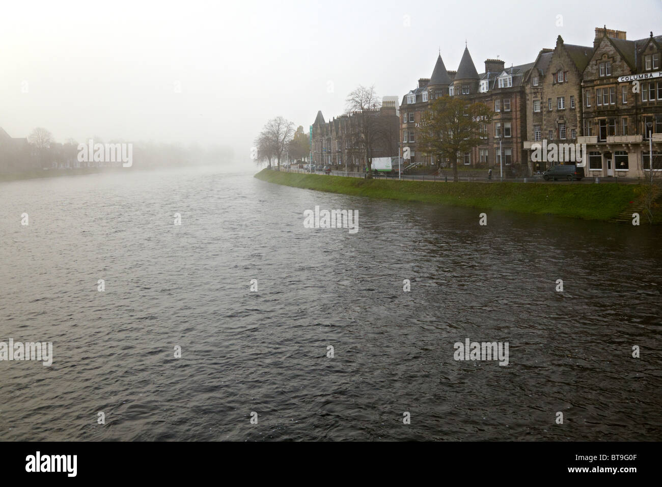 Misty Inverness morning looking upstream from the B861 bridge over the River Ness . Ness Walk to the right. Stock Photo
