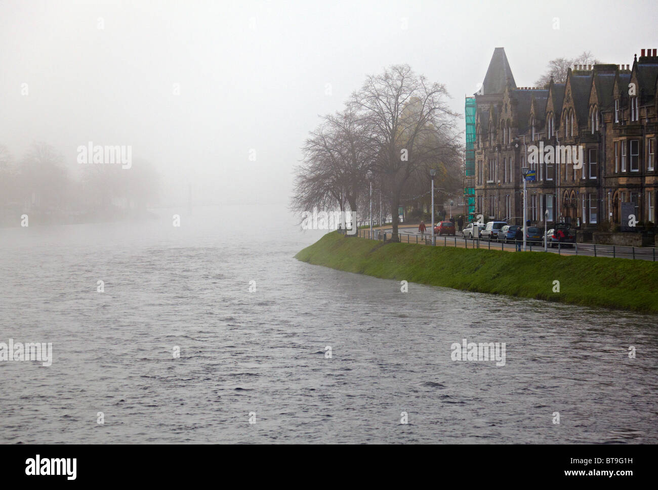 Misty Inverness morning looking upstream from the B861 bridge over the River Ness . Ness Walk to the right. Stock Photo