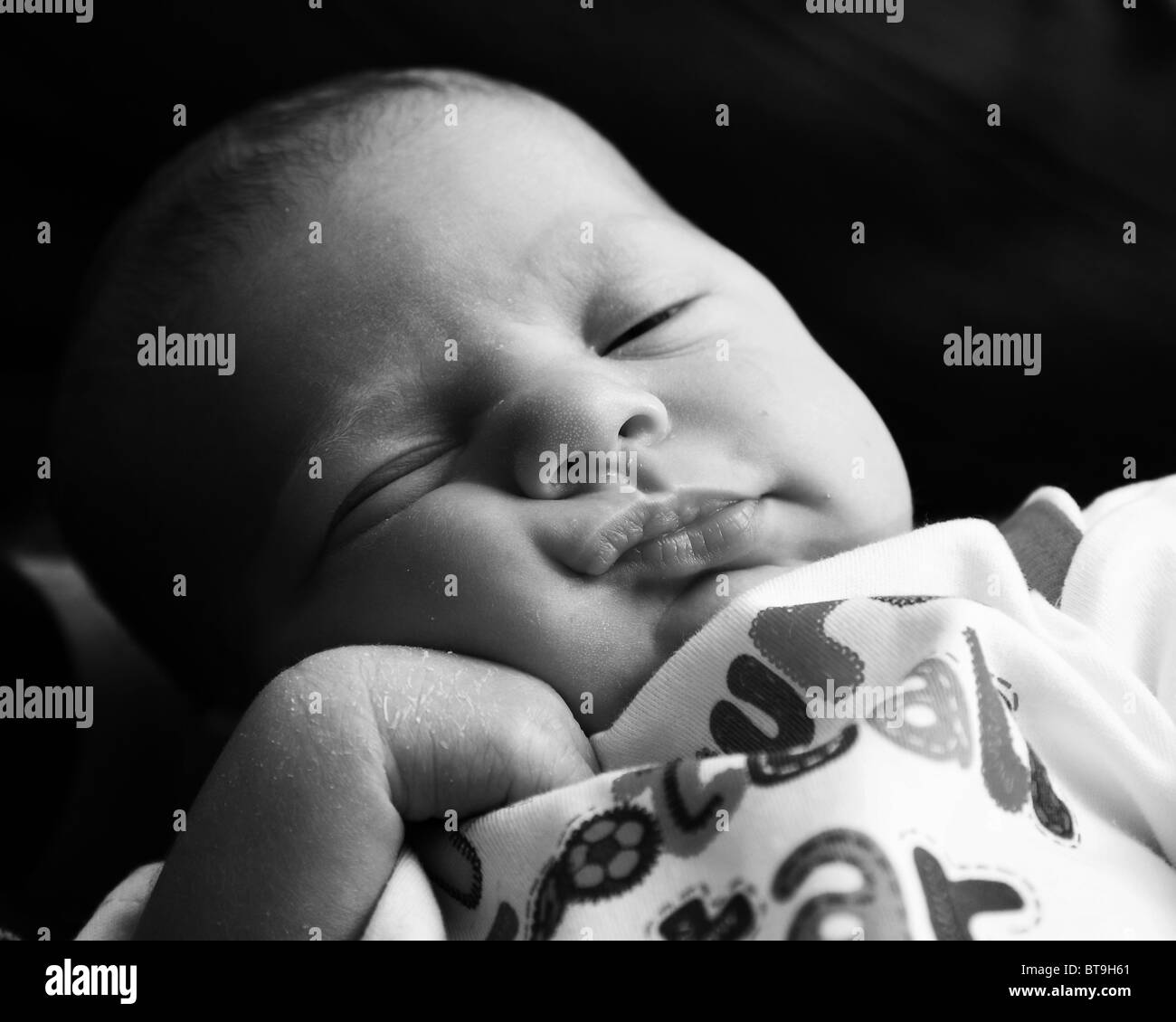 a two week old baby sleeping Stock Photo Alamy