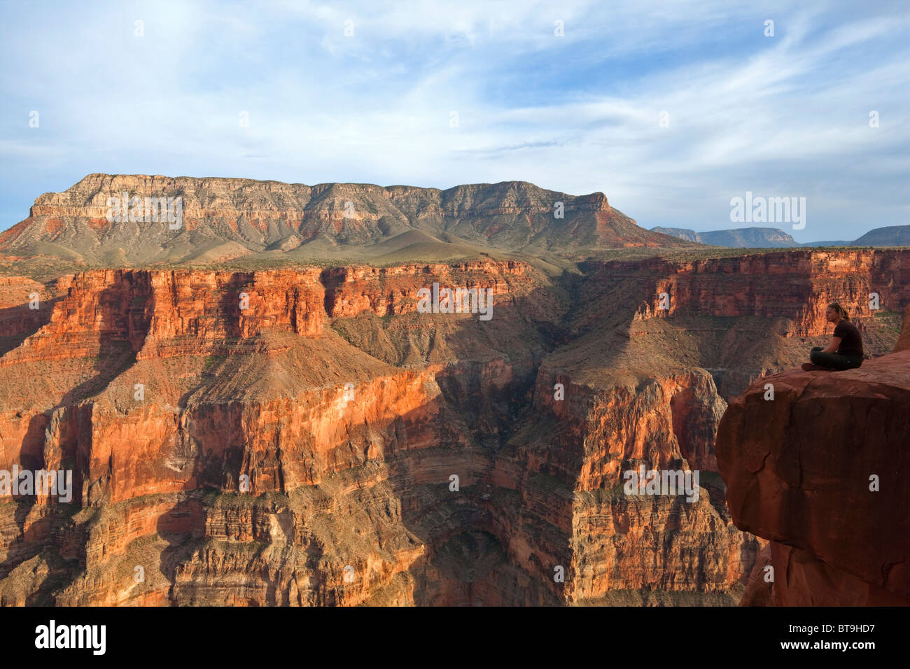 Tourist on the edge of the Grand Canyon, Toroweap Point, Tuweep Area, North Rim, Arizona, USA Stock Photo