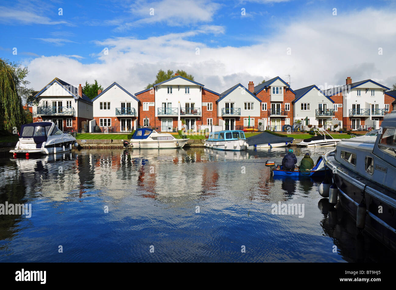 Loddon, Norfolk, England riverside houses and moored boats Stock Photo