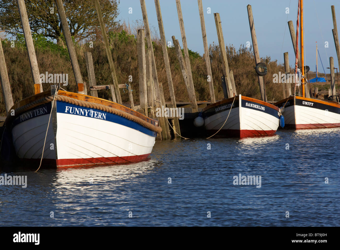 Blakeney on the North Norfolk Coast showing moored and stored boats Stock Photo