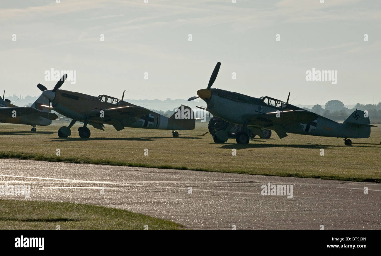 Two Messerschmitt BF-109's stand ready, early morning, for their participation in a Battle of Britain commemoration, 2010 Stock Photo