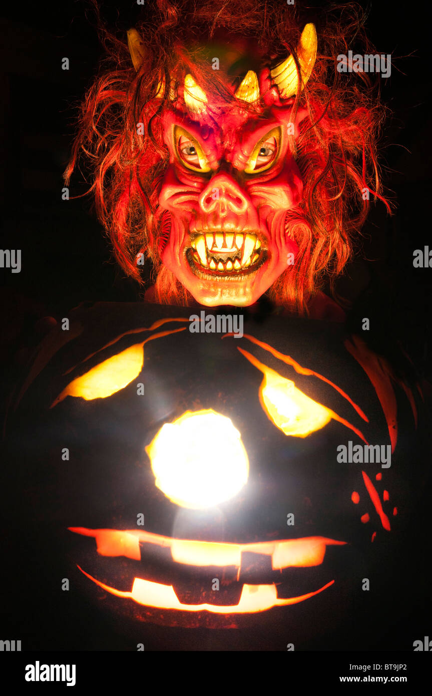 Halloween mask and pumpkin lantern Stock Photo