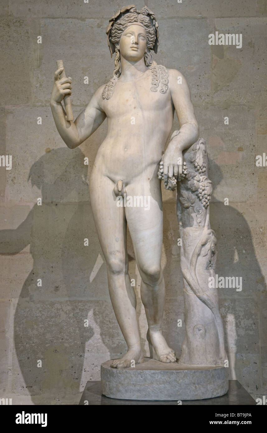 Statue of Bacchus Roman or Dionysus Greek God of grape harvest, winemaking and wine, Louvre Museum Paris Stock Photo