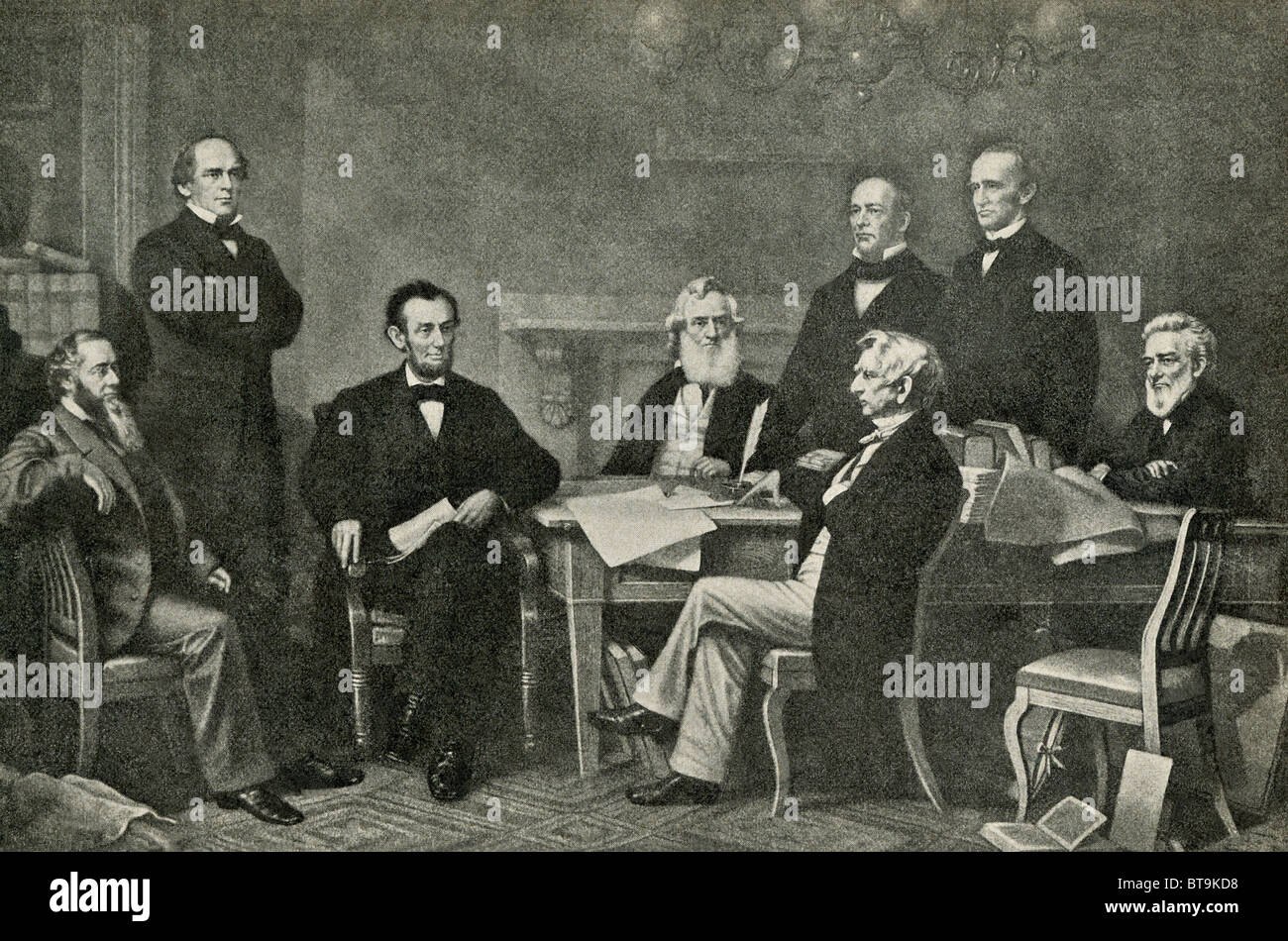 President Abraham Lincoln does the first reading of a draft of the Emancipation Proclamation in 1864 with his cabinet: Stock Photo