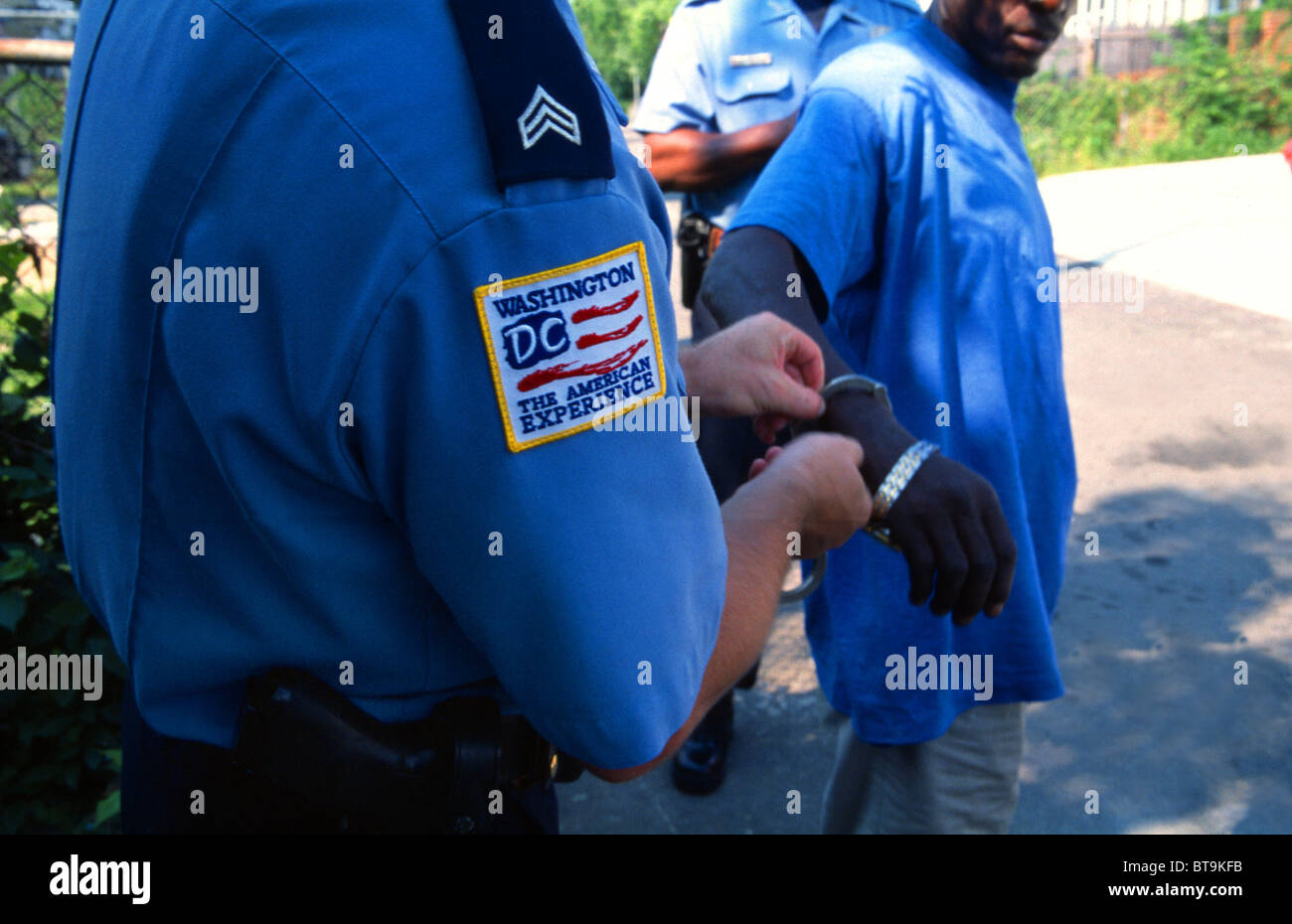 Police officer in Washington DC handcuffing a suspect Stock Photo Alamy