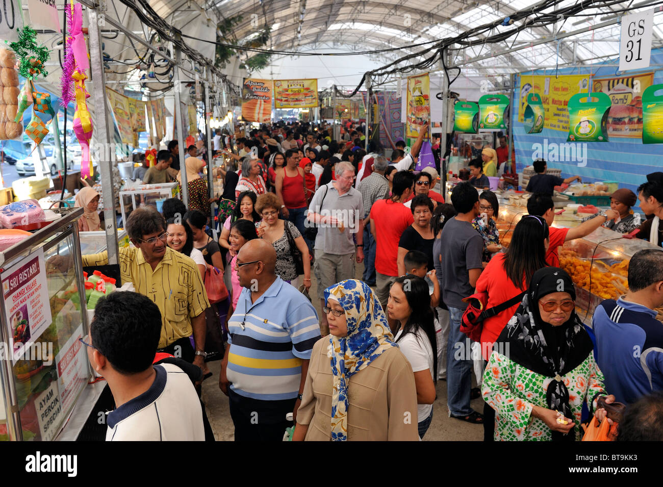 Crowds mass in Katong at Ramadan food stalls, nothing they can eat before dusk. Stock Photo