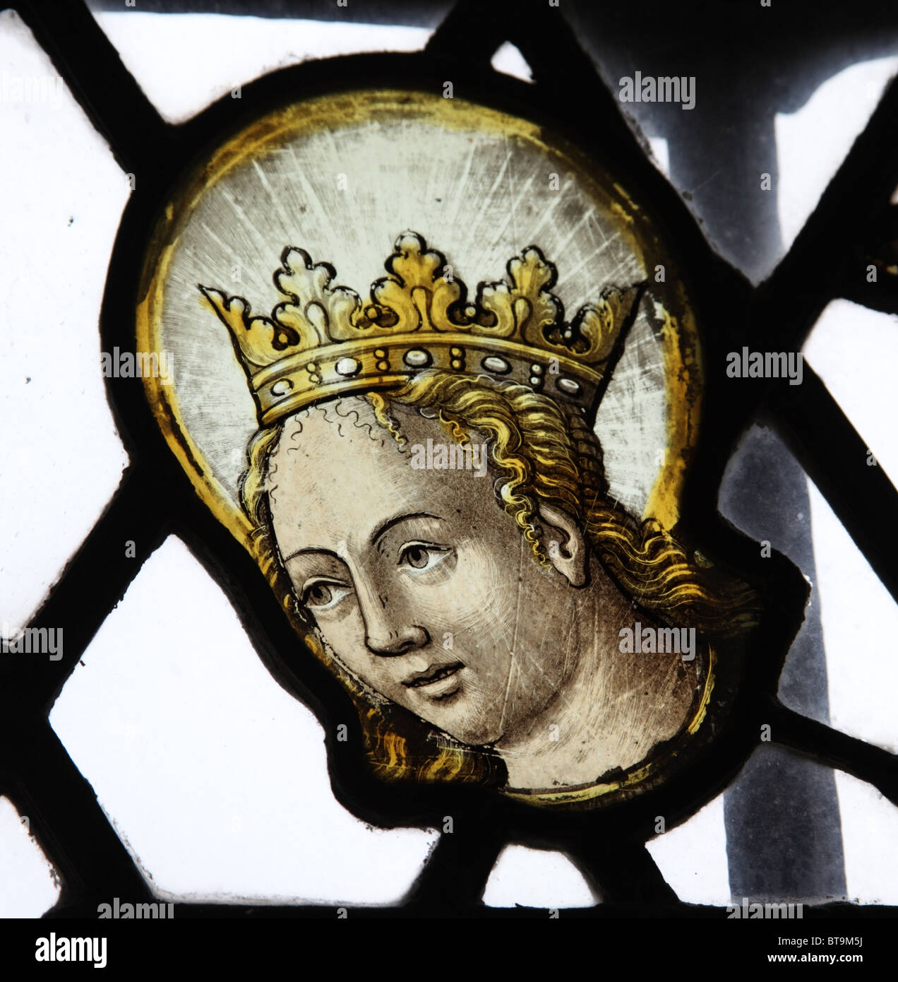 16th century fragment of Flemish stained glass depicting the head of the Virgin Mary, St Mary the Virgin Church, Luccombe, Somerset Stock Photo