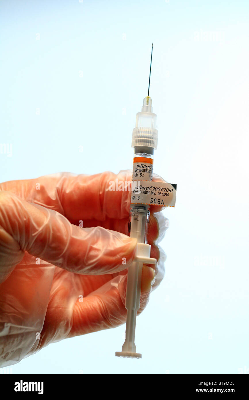 Syringe with vaccine for vaccination against the influenza flu virus, Influvac, preventive vaccination against the flu Stock Photo