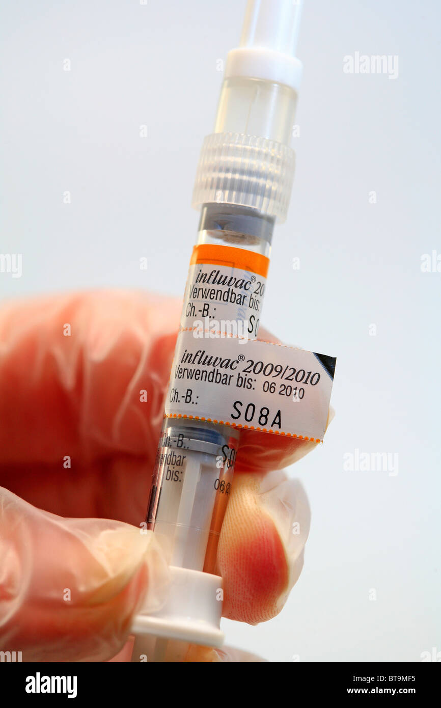 Syringe with vaccine for vaccination against the influenza flu virus, Influvac, preventive vaccination against the flu Stock Photo