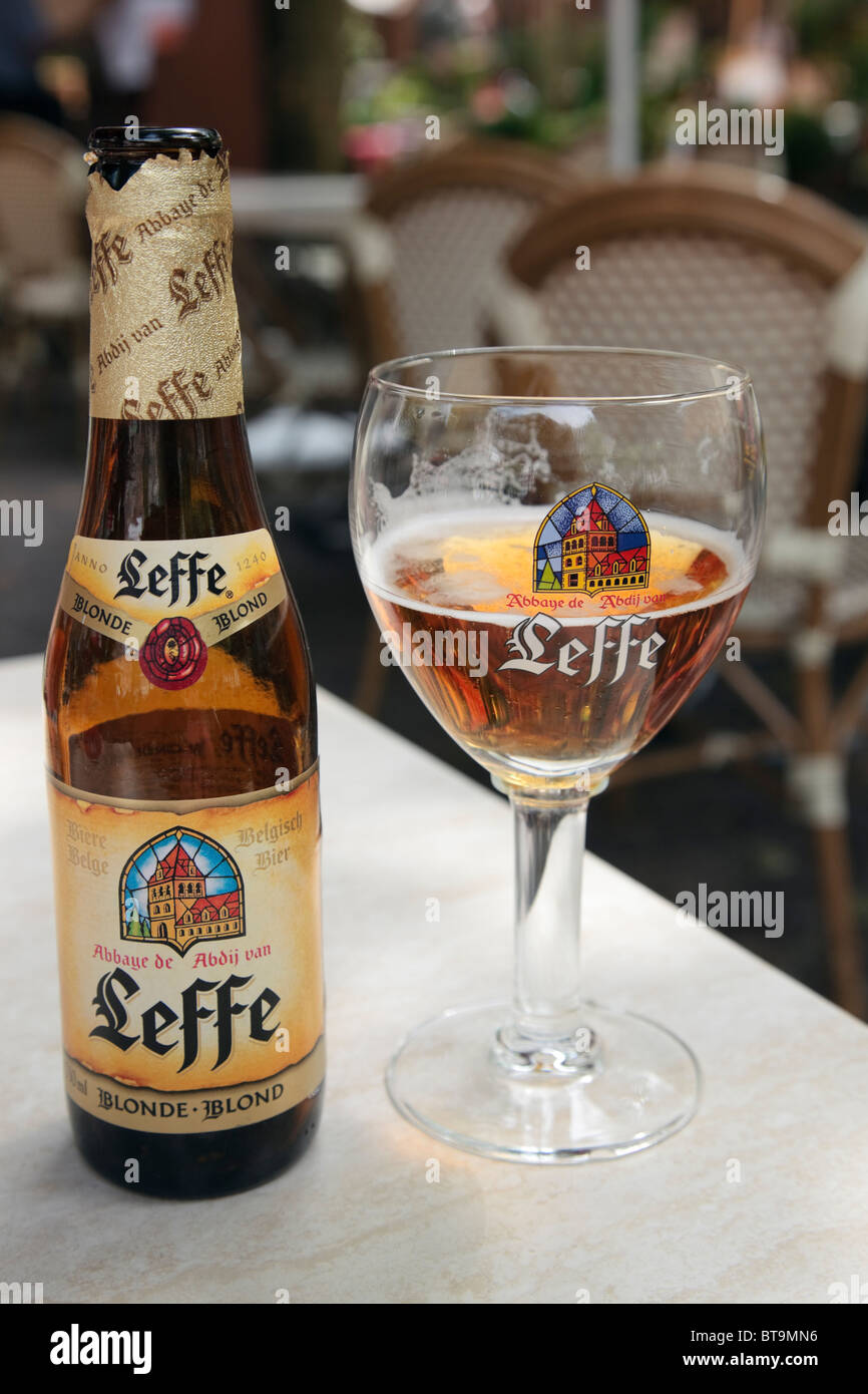 Luxembourg, Europe. Bottle of Leffe blond Belgian beer and glass on a table in a restaurant Stock Photo