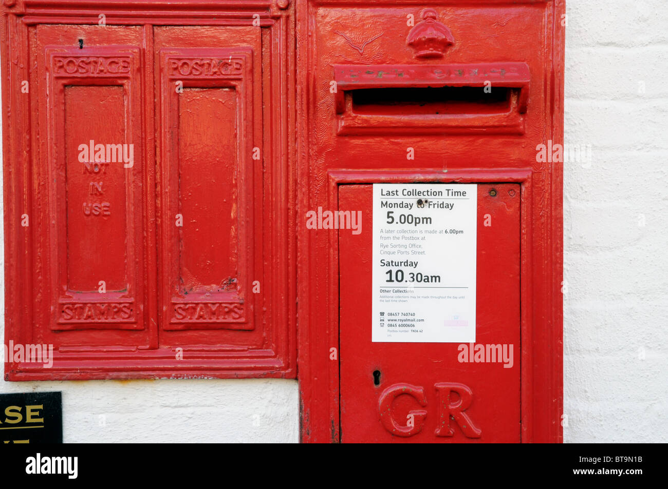 A Royal Mail letter box with a stamp sales facility (not in use) set